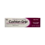 Cushion Grip 28 g – przód opakowania termoplastycznego kleju mocującego do protez zębowych bez cynku